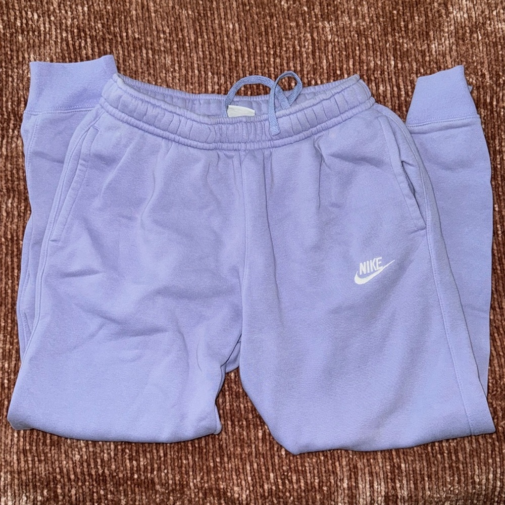 Small purple Nike sweatpants.